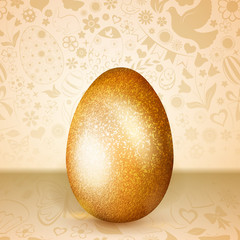 Big golden Easter egg standing on background of flowers, cakes, hare, chicken and other holiday symbols