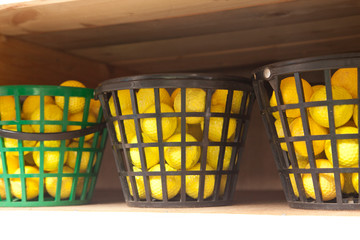 Buckets of yellow driving range balls