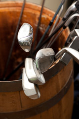 Golf clubs in a barrel