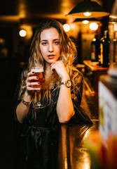 Young woman enjoys a beer