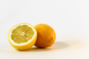 Fototapeta na wymiar Half lemon citrus fruit isolated on white