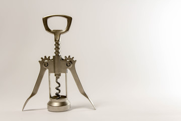 Metal wine bottle opener isolated over the white background