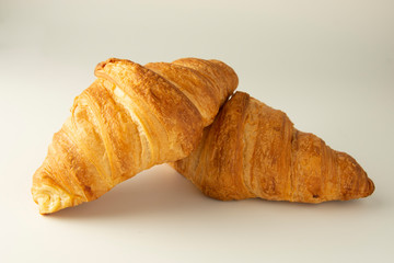Fresh and tasty croissant over white background. Isolated, tempalte for breakfast food.