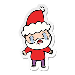 sticker cartoon of a bearded man crying wearing santa hat