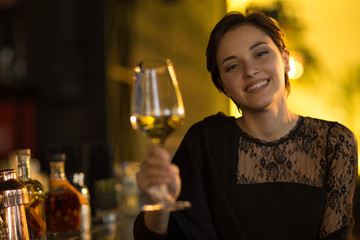 Young beautiful woman relaxing at the bar