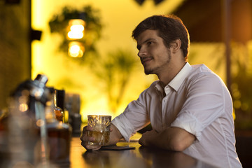 Handsome young man at the bar