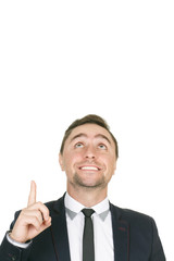 Idea. Closeup studio shot of a smiling businessman pointing up on a copyspace