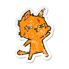 distressed sticker of a tough cartoon cat