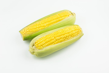 Two Fresh corn isolated on white background