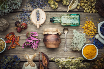 Dry medicinal herbs, plants, roots, ingredients for making herbal medicine drugs, bottle of...
