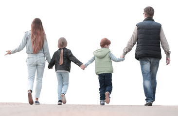 Obraz premium rear view . a happy family goes forward.