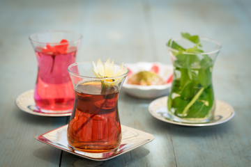 traditional Turkish red black tea tulip glass green flowers sweet dessert afternoon tea break