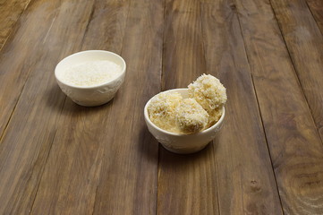 coconut balls on the wooden table