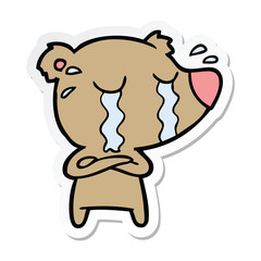 sticker of a cartoon crying bear