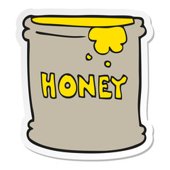 sticker of a cartoon honey pot