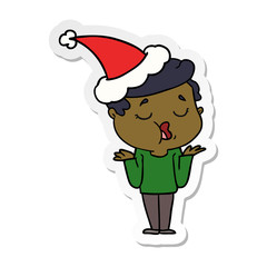 sticker cartoon of a man talking and shrugging shoulders wearing santa hat
