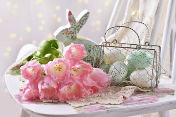 easter decoration with bunch of pink tulips eggs and bunny