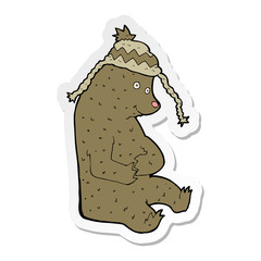 sticker of a cartoon bear in winter hat