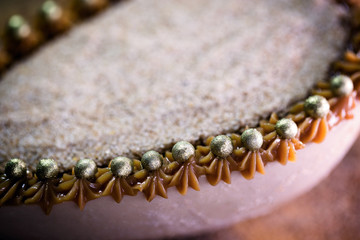 Chocolate egg filled with Brazilian sweet cream and sweet milk for Easter on wooden background