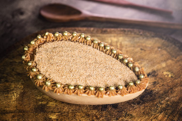Chocolate egg filled with Brazilian sweet cream and sweet milk for Easter on wooden background