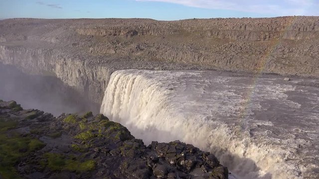 Dettifoss, Iceland, one of the most remarkable waterfalls in the world, with rainbow.
