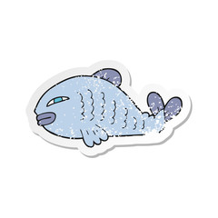 retro distressed sticker of a cartoon fish