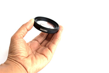 hand with lens on white background