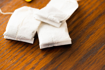 Pile of teabags in a box on table