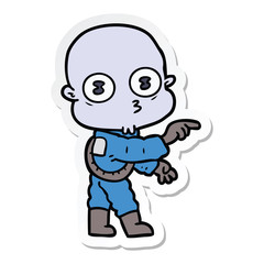 sticker of a cartoon weird bald spaceman pointing