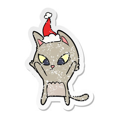 confused distressed sticker cartoon of a cat wearing santa hat