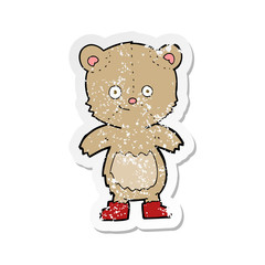 retro distressed sticker of a cartoon cute teddy bear