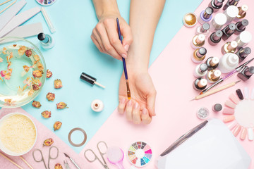 manicured beauty salon, nail care and care. Woman gets a manicure nails.