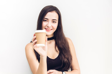 Businesswoman holding cup of coffee isolated on white background