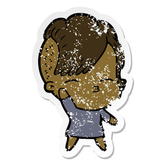 distressed sticker of a cartoon squinting girl