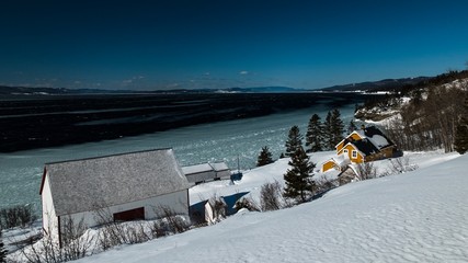 The Blanchette House in Forillon National Park on a bright sunny winter day.