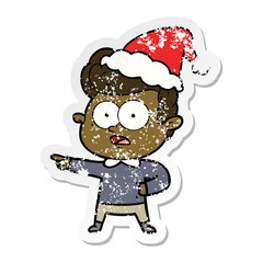 distressed sticker cartoon of a staring man wearing santa hat