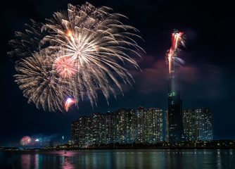 Ho Chi Minh City, Vietnam - February 4th, 2019: Colorful fireworks welcome lunar new year view from skyscraper at night. This is tallest building in Vietnam and top 10 tallest buildings in the world