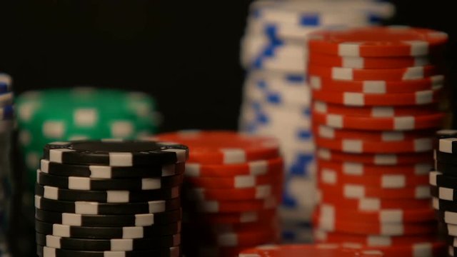 Casino chip rows standing on table, winning big sum of money, poker bets