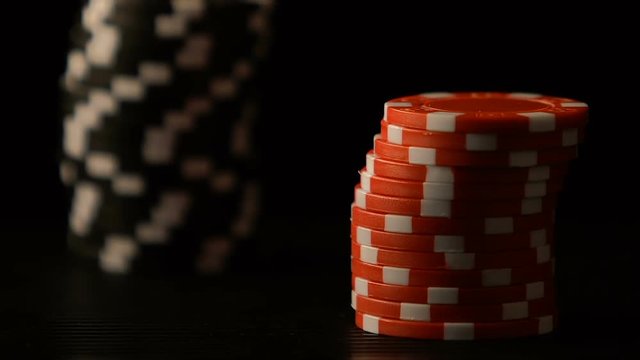 Female hands putting poker chips on table, casino game bet, winning strategy
