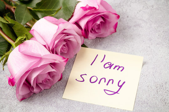 bouquet of pink roses, a heart and a note with the inscription I love you on the table-the concept of love and care