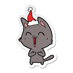 happy sticker cartoon of a cat wearing santa hat