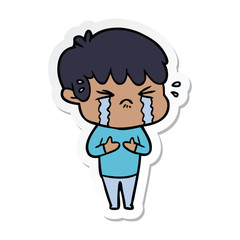 sticker of a cartoon boy crying