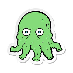 sticker of a cartoon alien squid face