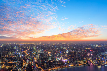 Shanghai city skyline and beautiful colorful clouds at night