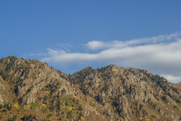 Fototapeta premium Rocky mountains and blue cloudy sky