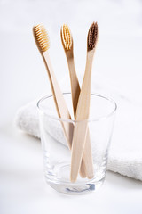 bamboo toothbrushes in glass