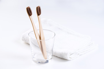 bamboo toothbrushes in glass