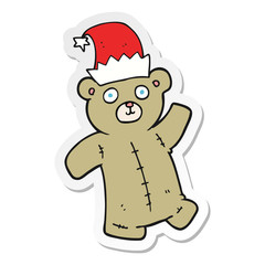 sticker of a cartoon teddy bear wearing christmas hat