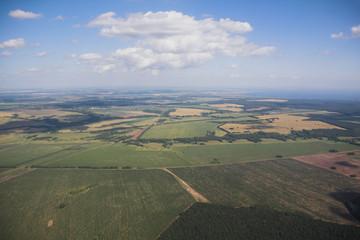 Naklejka premium Agricultural fields and sky, view from plane. Kazan, Russia