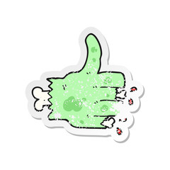 retro distressed sticker of a cartoon zombie hand